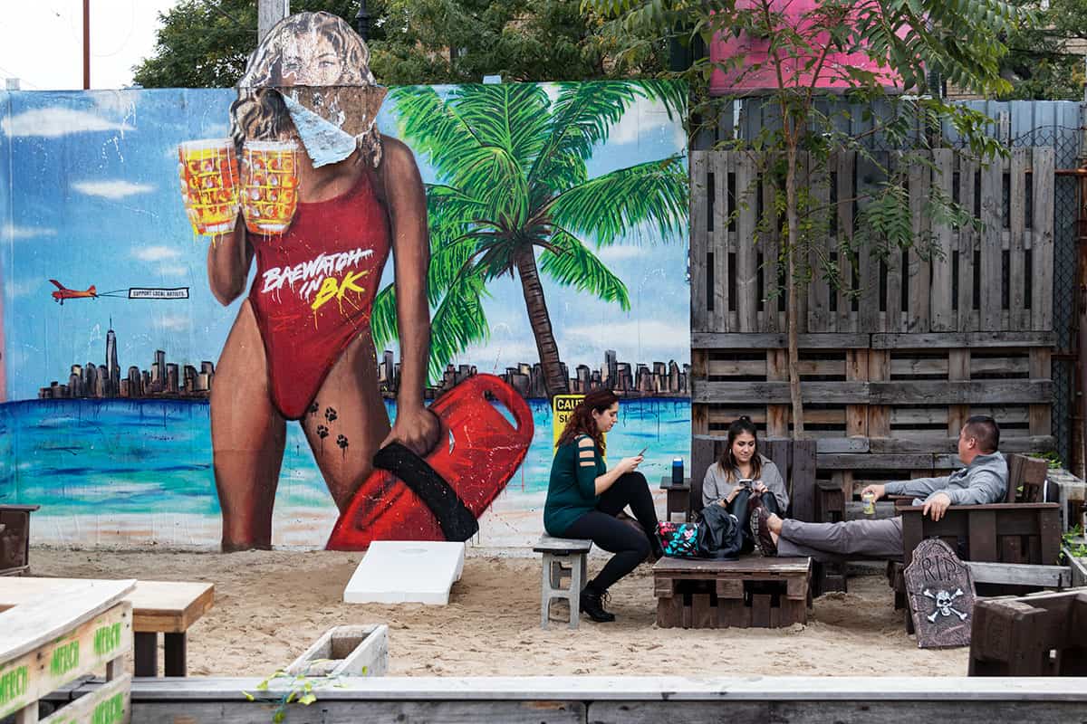 People hanging out in Brooklyn beer garden in Bushwick NYC