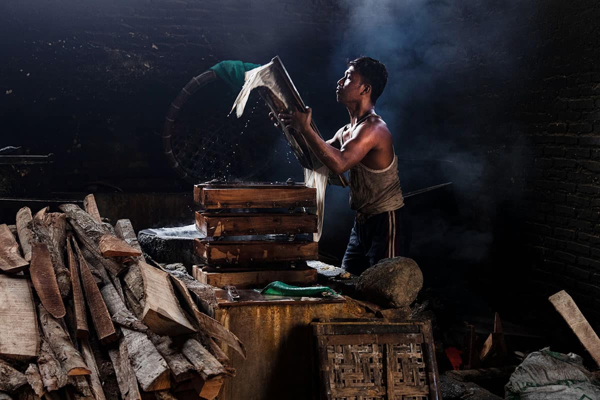 A local Indonisian man making tofu in Yogyakarta Indonesia