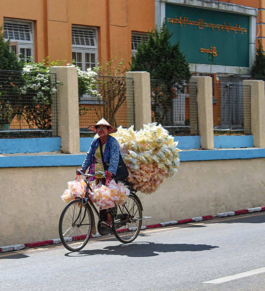 A man riding on his bike in Burma