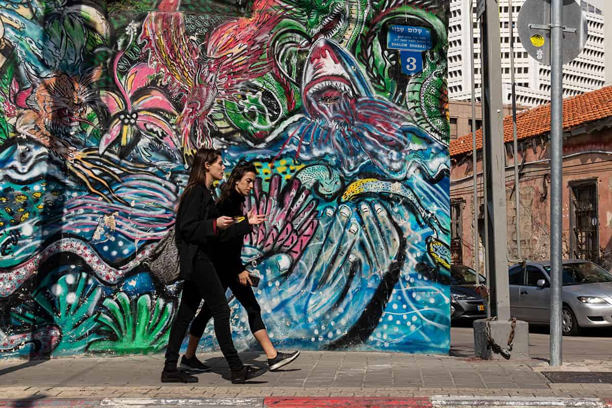 Two girls walking in Neve Tzedek neighborhood